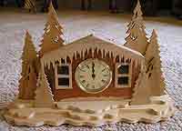 Snow Cabin Scroll Clock - $93