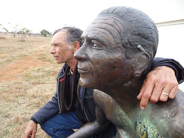 Colin Isaacs and his bronze statue created by International Bronze sculptor Kerry Cannon.